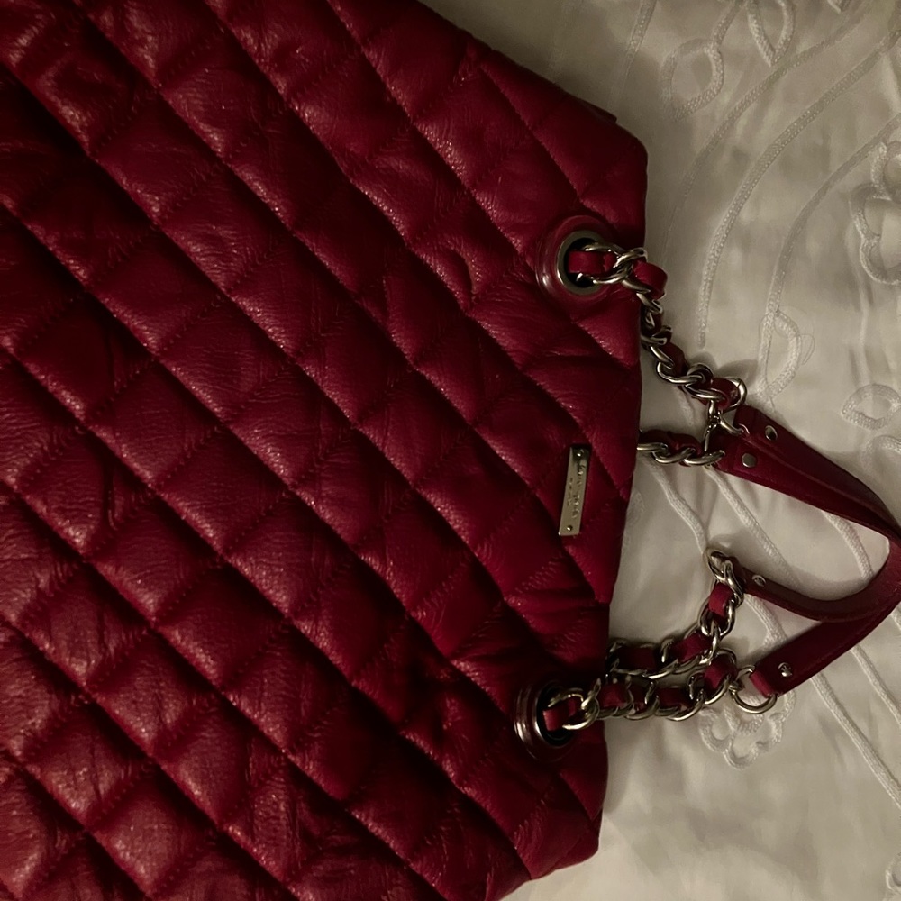 Large red bag from Kate Spade no tags with a light scratch in the front